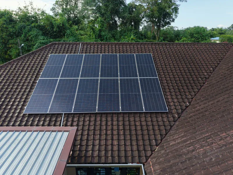 Rooftop solar panel array on a terrace house in Kuching, Sarawak